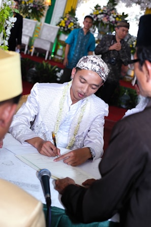 An official signing ceremony for a recruitment agreement at Wisam Aljanoub.