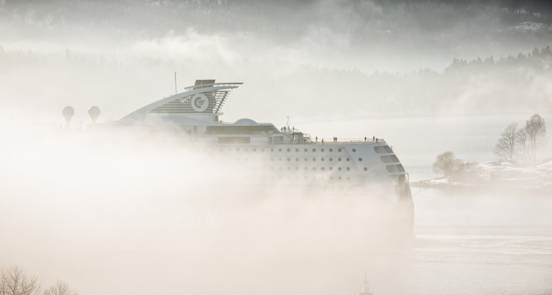 white cruise ship covered in mist, Misty Voyage