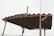 A rustic metal roof structure with a weathered sign displaying the text 'BN0670'. The roof is supported by metal poles and has a corrugated design, evoking a sense of aged industrial utility. A long vertical pole is attached to one side of the structure.