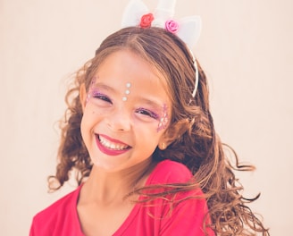 girl in pink shirt smiling