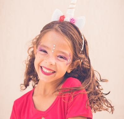 girl in pink shirt smiling