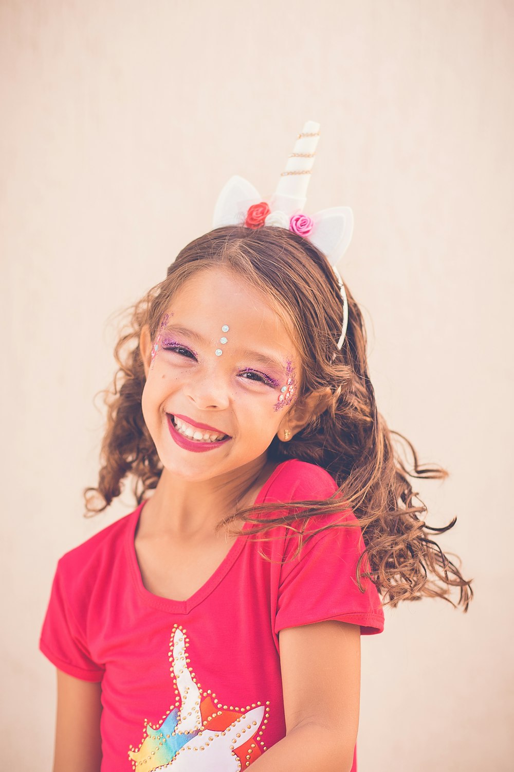 girl in pink shirt smiling