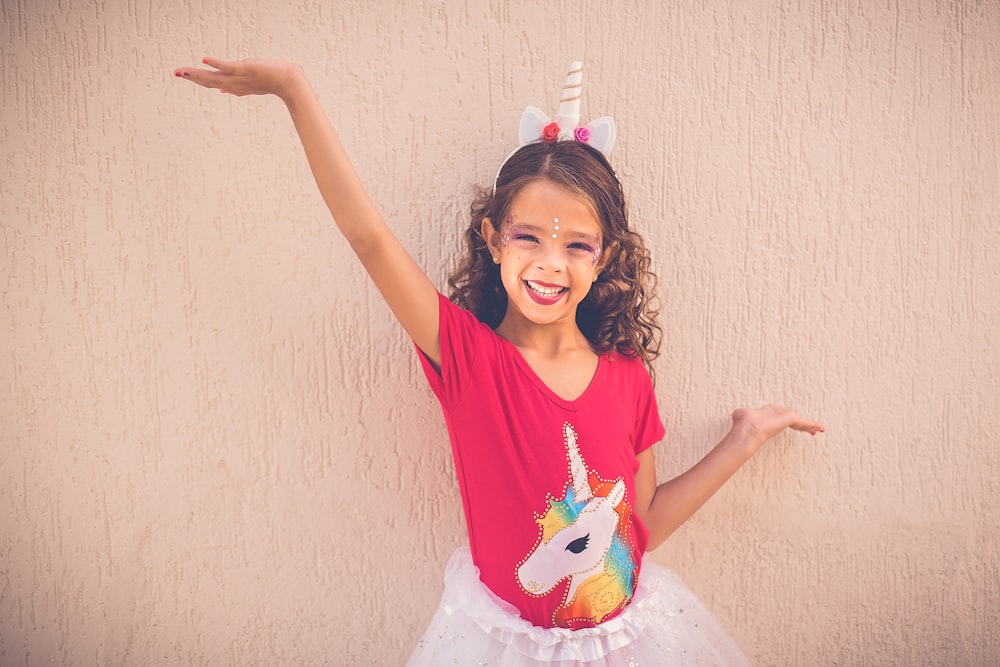 girl wearing unicorn graphic tutu skirt