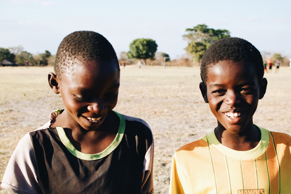 two boys smiling for photo