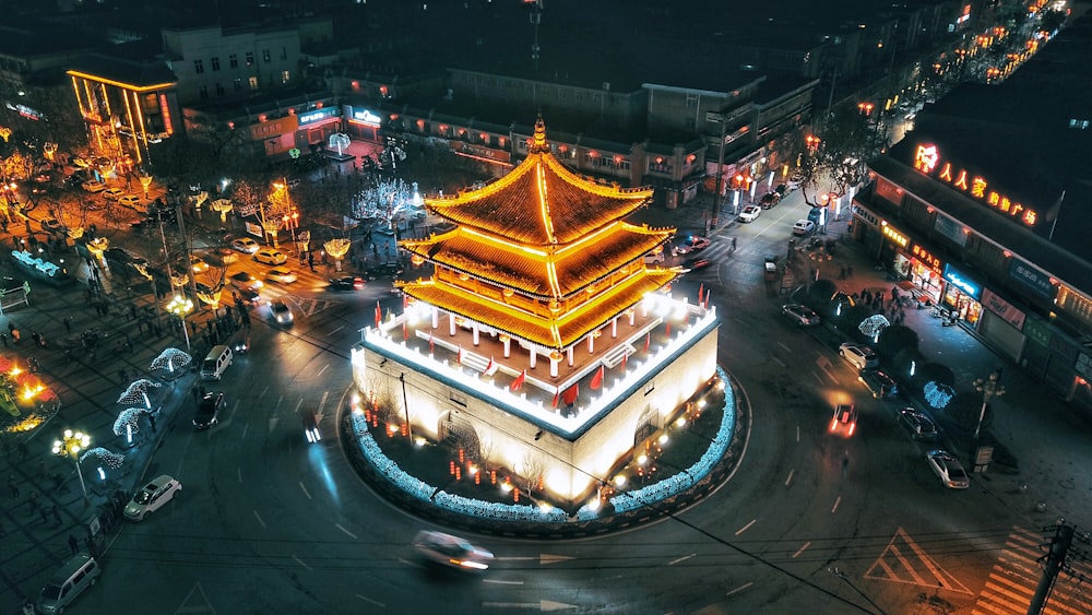 orange and white pagoda near road