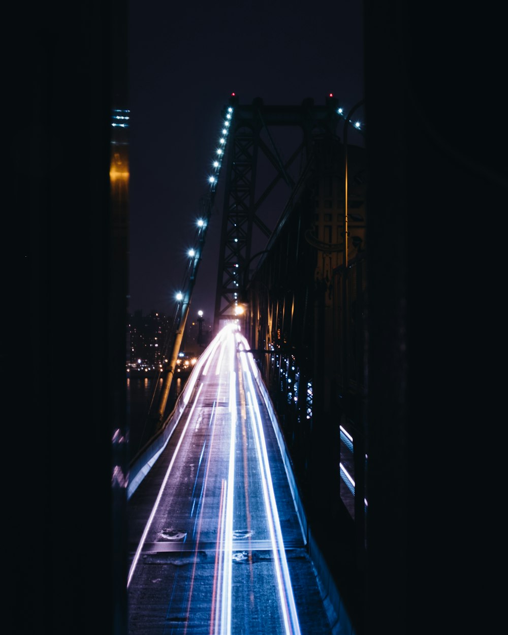time-lapse photography of cars passing through bridge