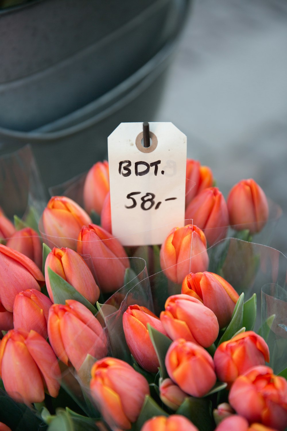 three bouquets of orange flowers