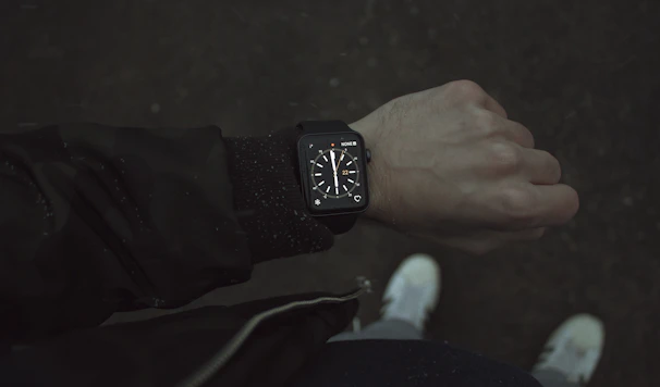 An influencer wearing a smart accessory in an urban setting with moody lighting.