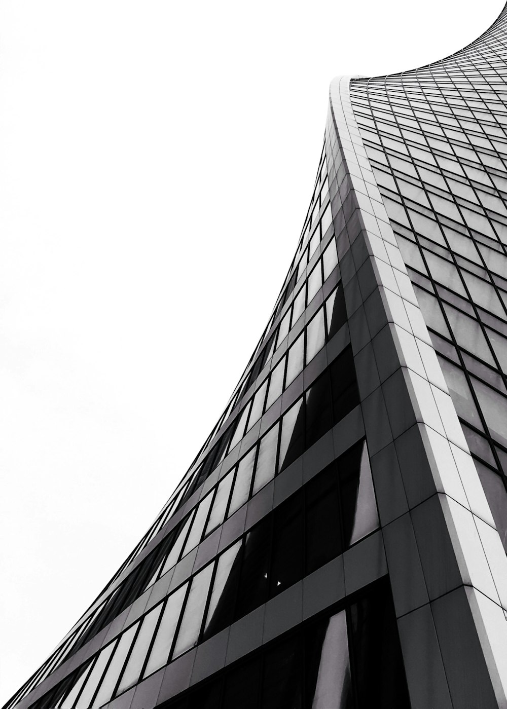 low angle photography of grey high-rise building