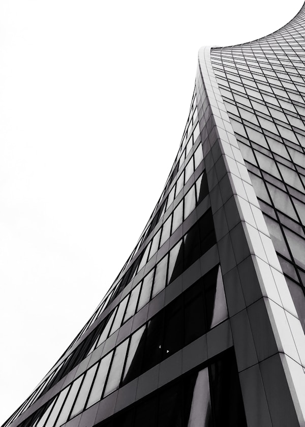 low angle photography of grey high-rise buildingby Vladimir Malyavko