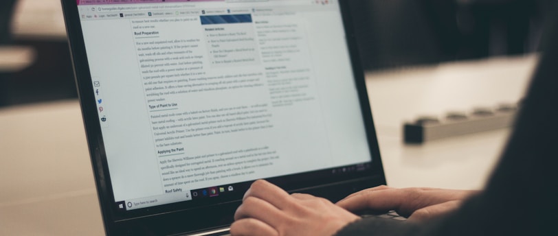 person typing on laptop computer