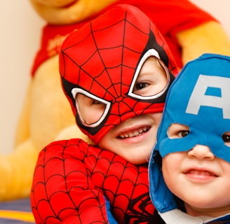 kids in spiderman and Captain America costumes