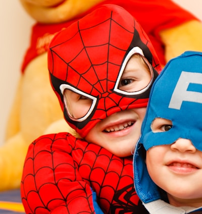 kids in spiderman and Captain America costumes