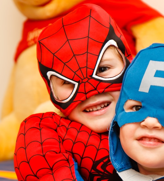 kids in spiderman and Captain America costumes