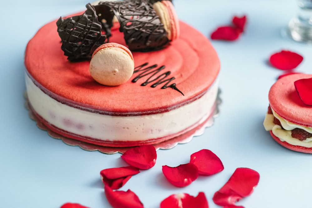 round red and white cake with cookies toppings