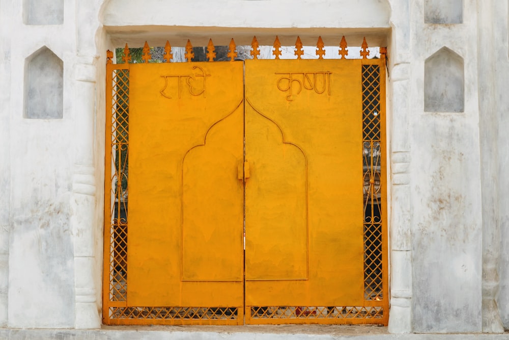closeup photography of orange metal two-door gate