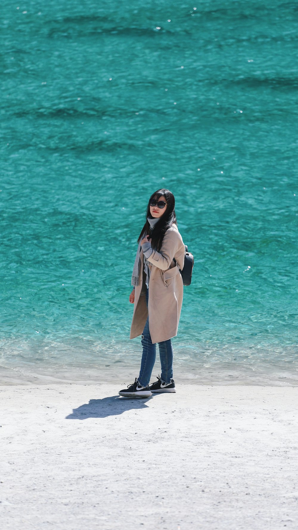 woman standing on beach shore