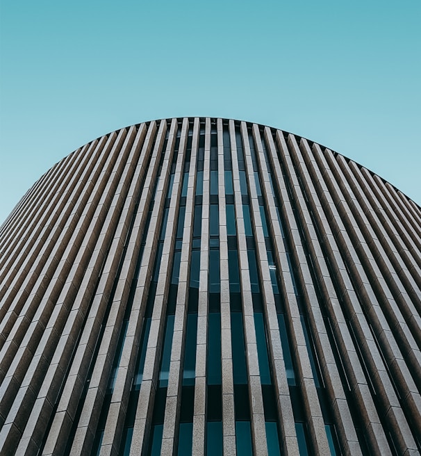 low angle photo of curtain wall building during daytime