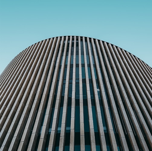 low angle photo of curtain wall building during daytime