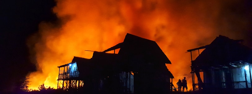 silhouette of houses during nighttime