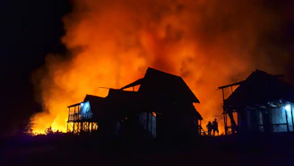 silhouette of houses during nighttime