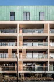brown and green 5-storey building during daytime