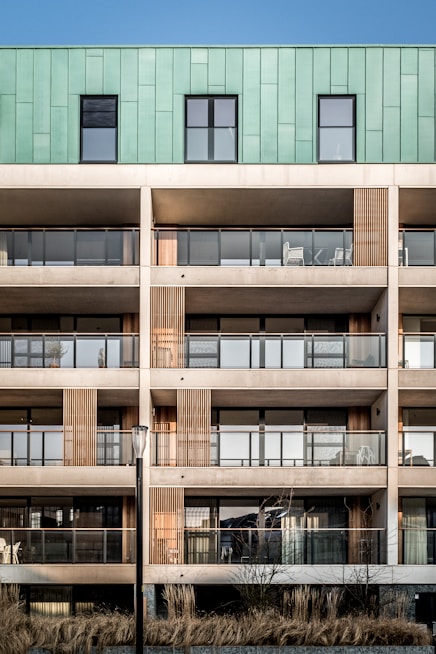 brown and green 5-storey building during daytime