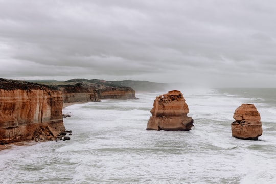 landscape photography of cliff beside body of water in Great Ocean Road Australia