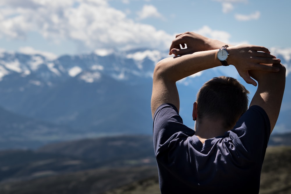 man reaching his other arm