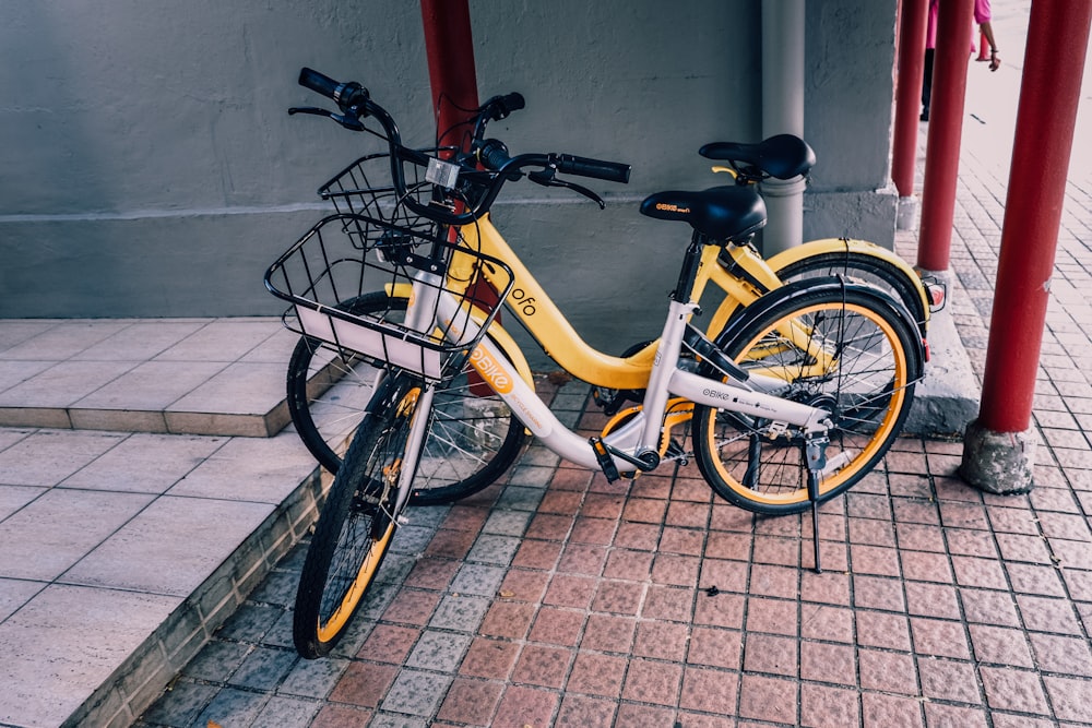 two yellow and white cruiser bikes