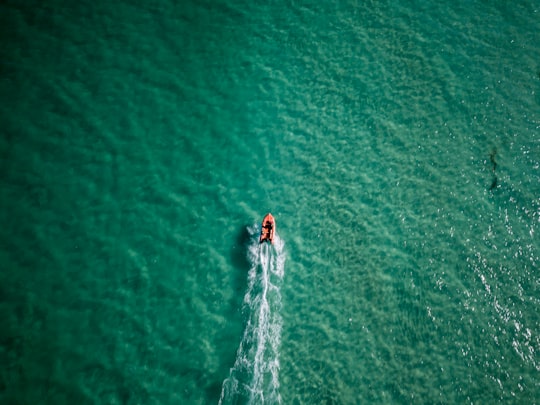 aerial photo of person riding kayak on bodies of water during daytime in Leighton Beach Australia