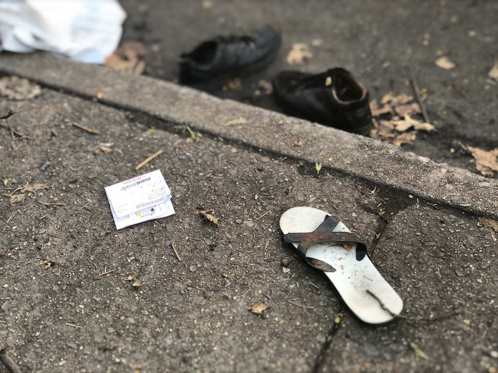 flip-flop on concrete pavement