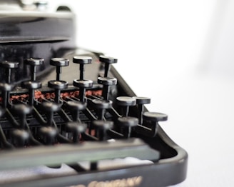 selective focus photography of typewriter keys