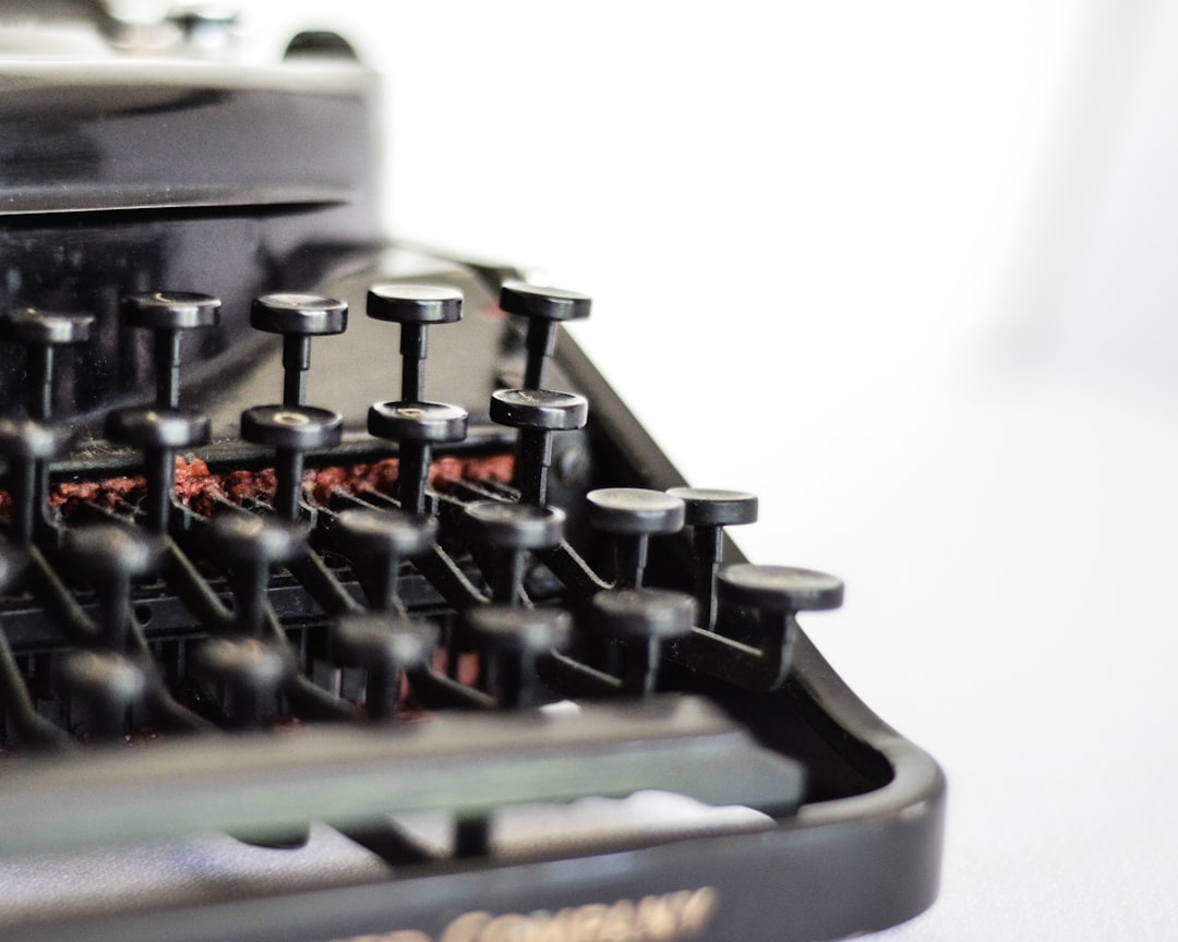 selective focus photography of typewriter keys