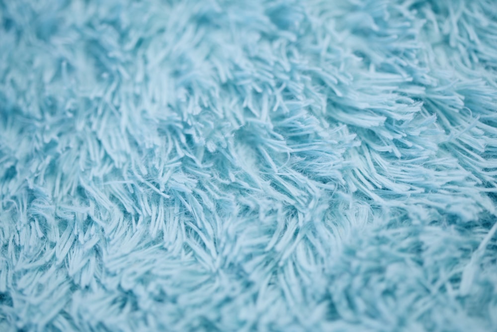 closeup photography of blue textile