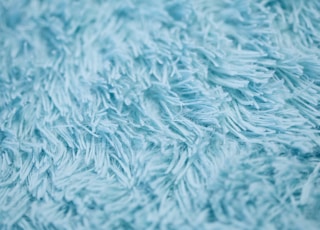 closeup photography of blue textile