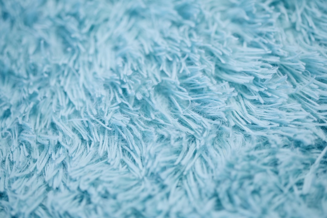 Whimsical baby blue furry wallpaper.