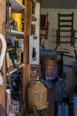 a room filled with lots of clutter and furniture