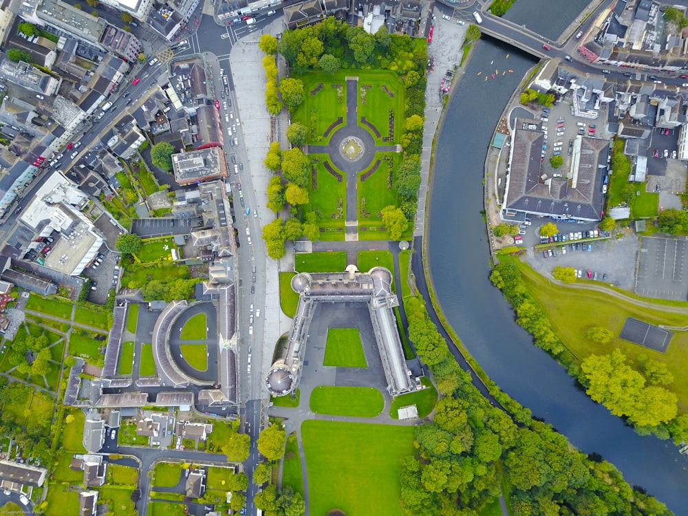 aerial photography of green grass covered field with buildings