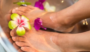 person's feet with flowers