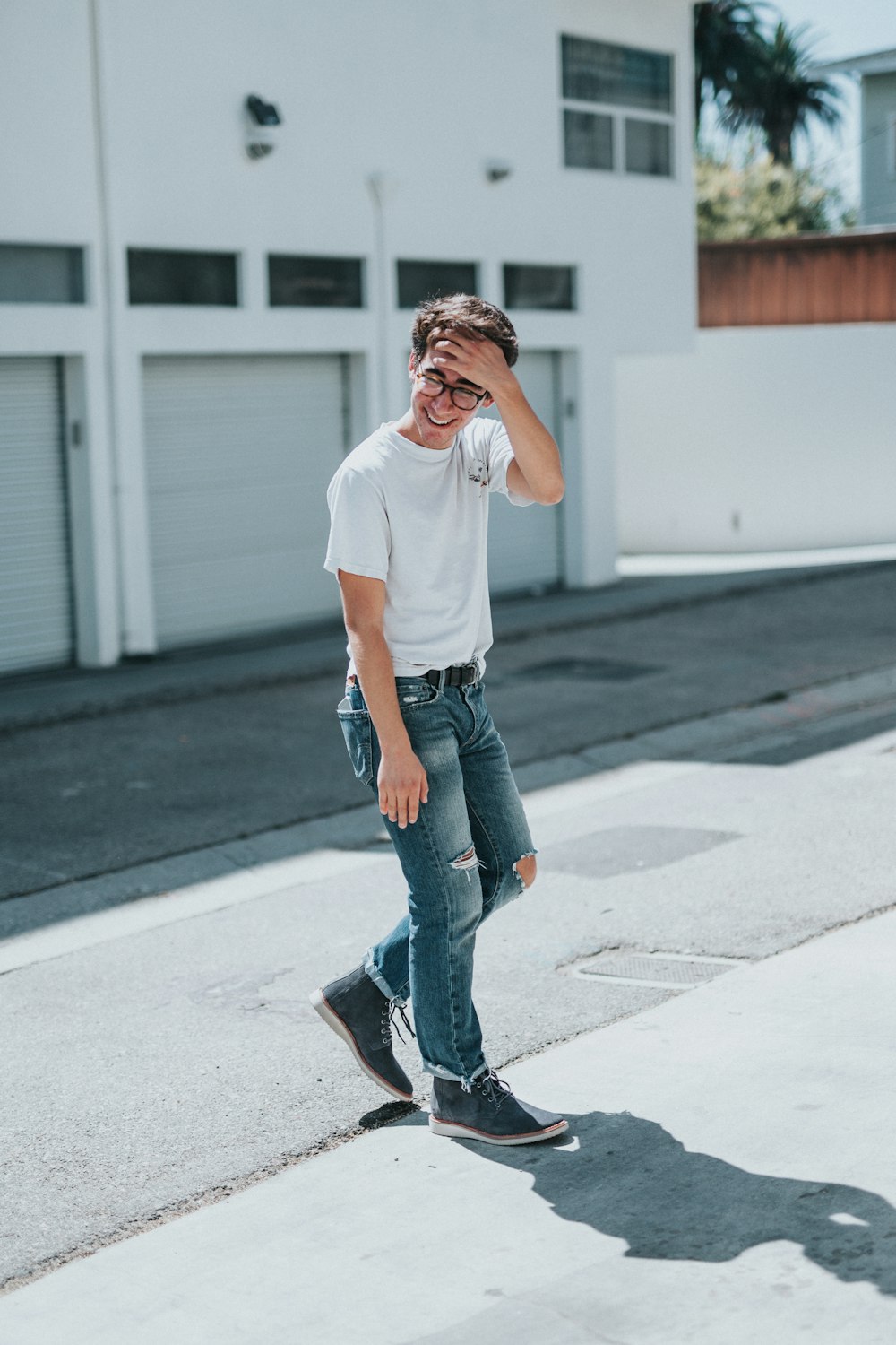 man standing on concrete pavement