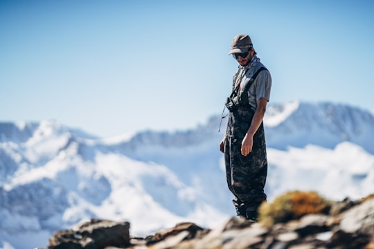 man standing on cliff during daytime in Sierra Nevada United States