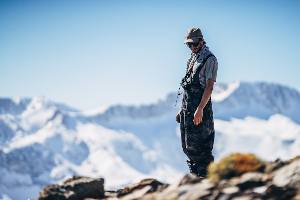 man standing on cliff during daytime