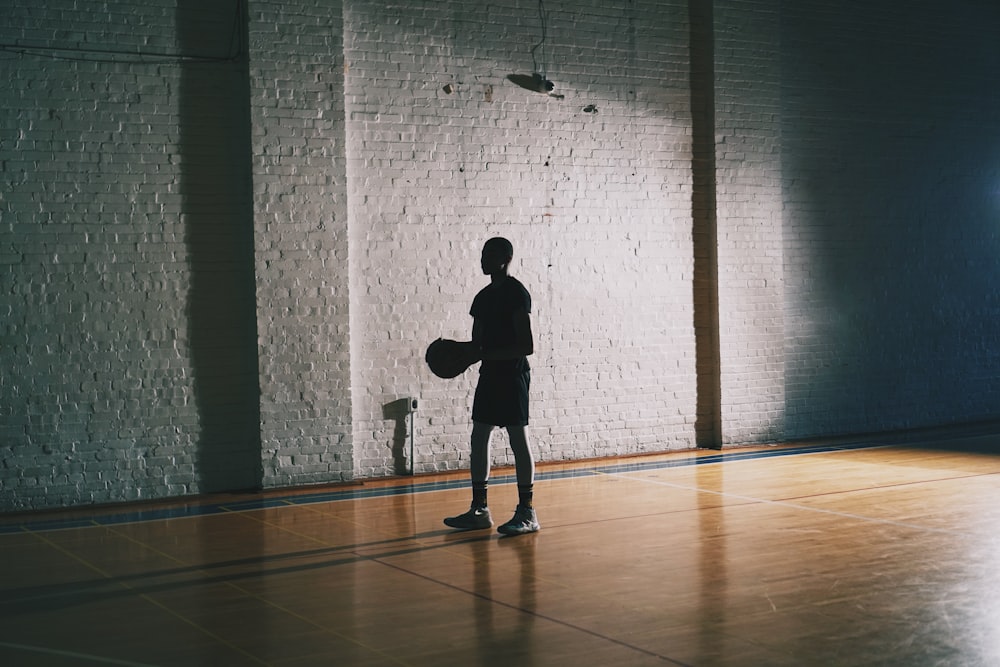 man holding basketball