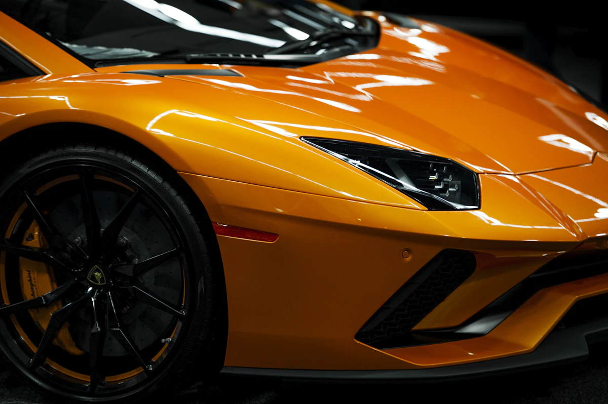 Custom-styled performance car with aftermarket detailing in low light