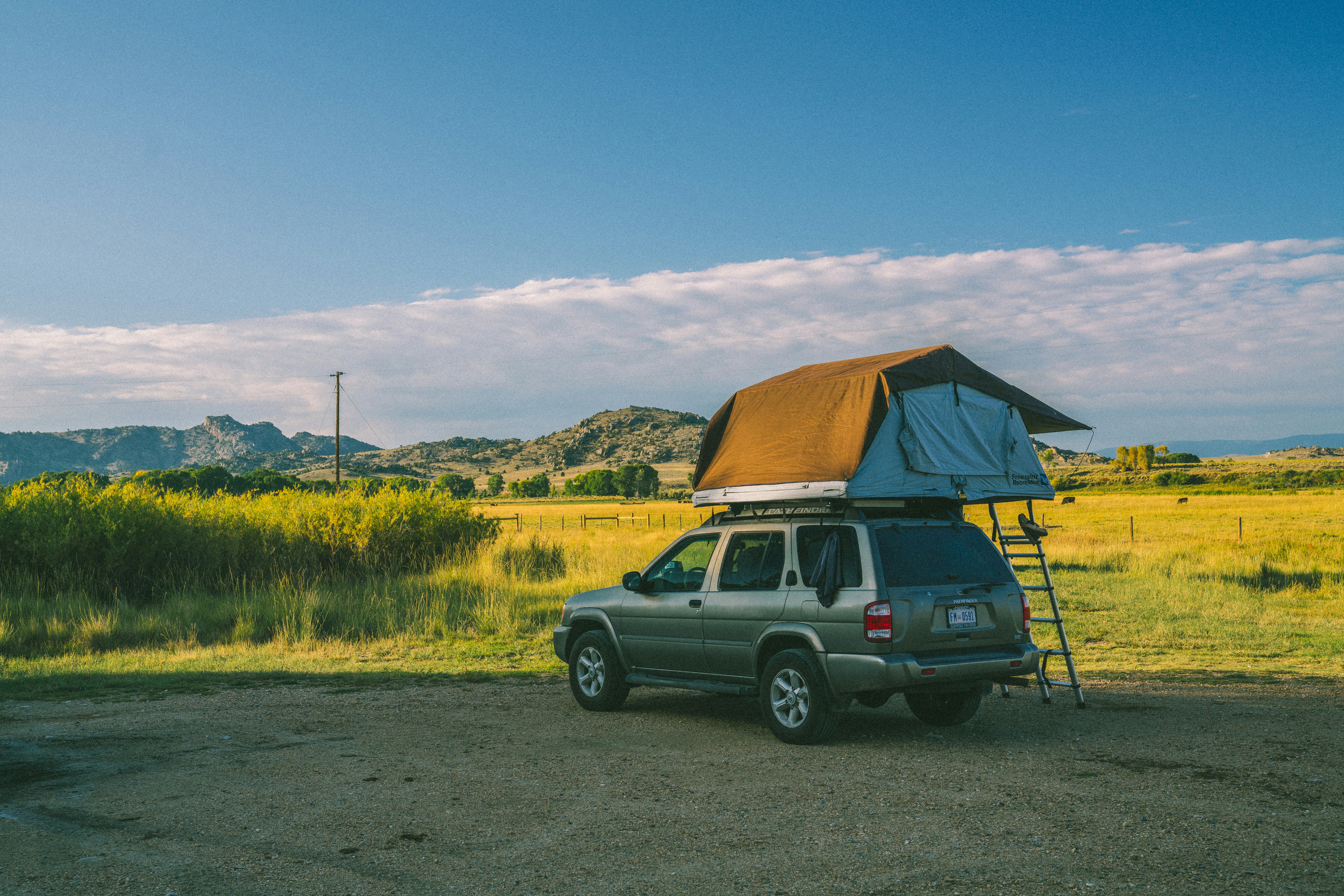 car with a roof top tent setup