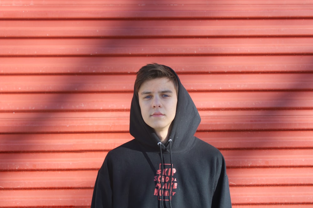 man wearing black and red pullover hoodie