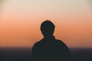 A still frame from a student’s short film showing a dramatic silhouette against a gradient indigo sky