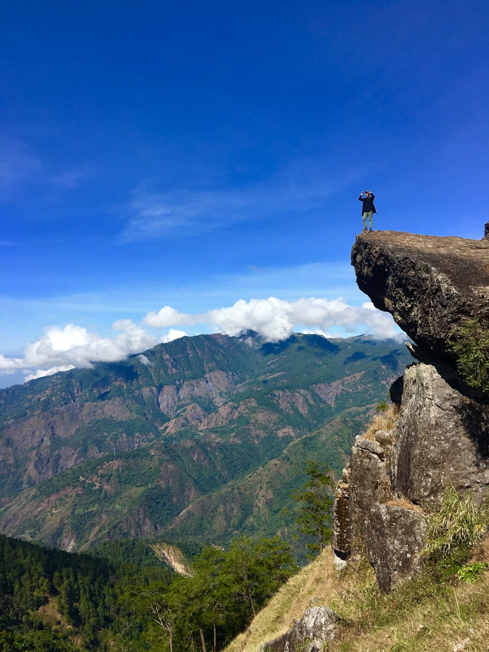 man standing on cliff