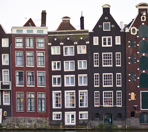 assorted-color houses under white sky